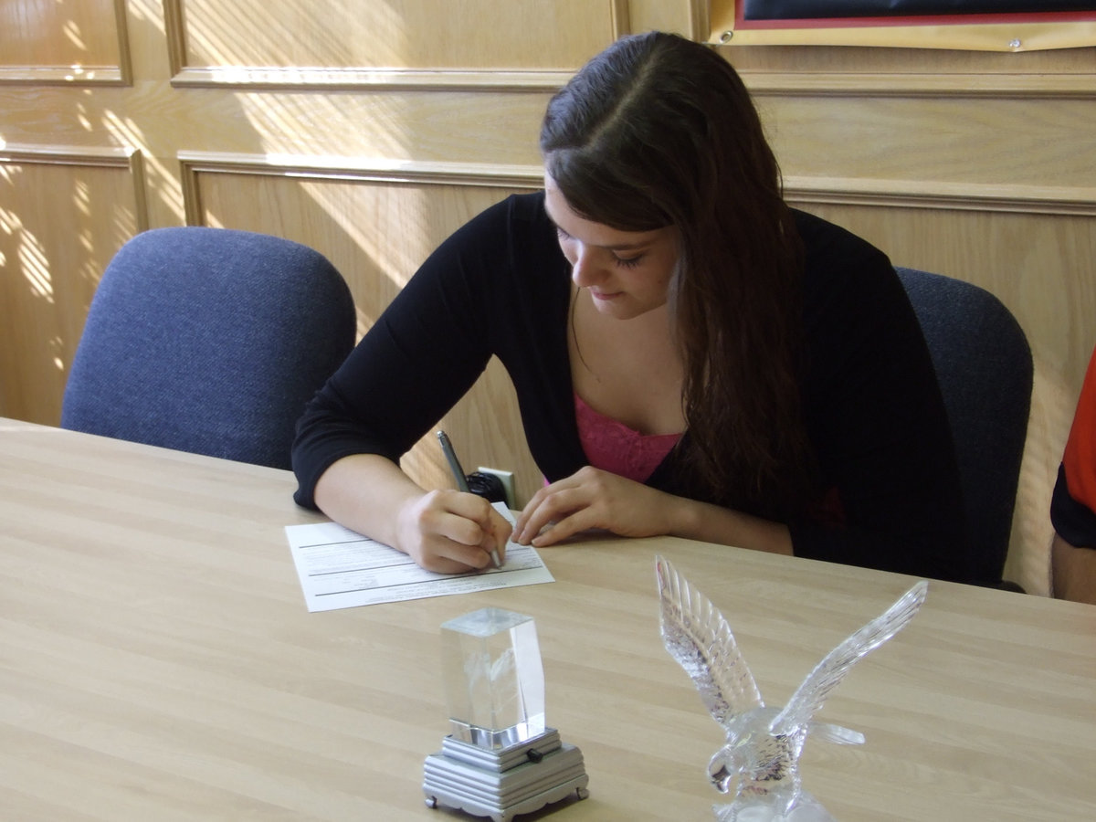 Image: Kimberly Gatlin signs — Kimberly proudly signs the Letter of Intent