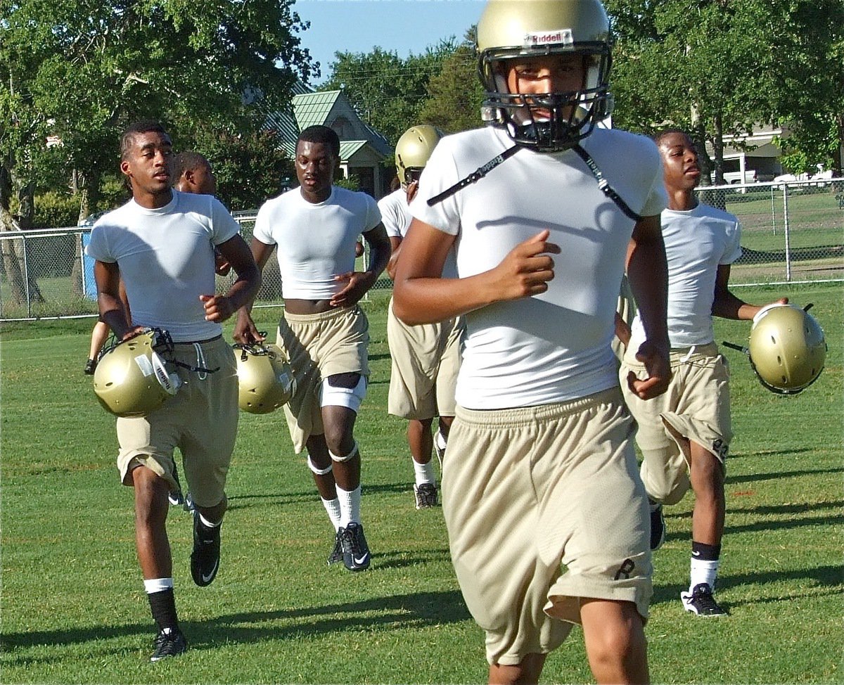 Image: Here they come — Heath Clemons, Corrin Frazier, Eddie Garcia and Eric Carson head toward their next drill.