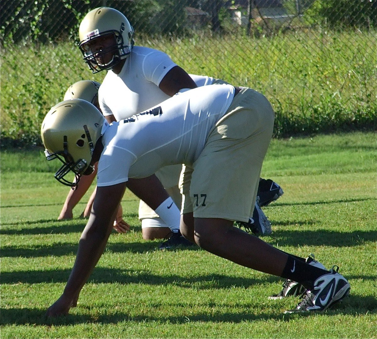 Image: Digging in — Larry Mayberry and noseguard Bobby Wilson get ready for the snap.