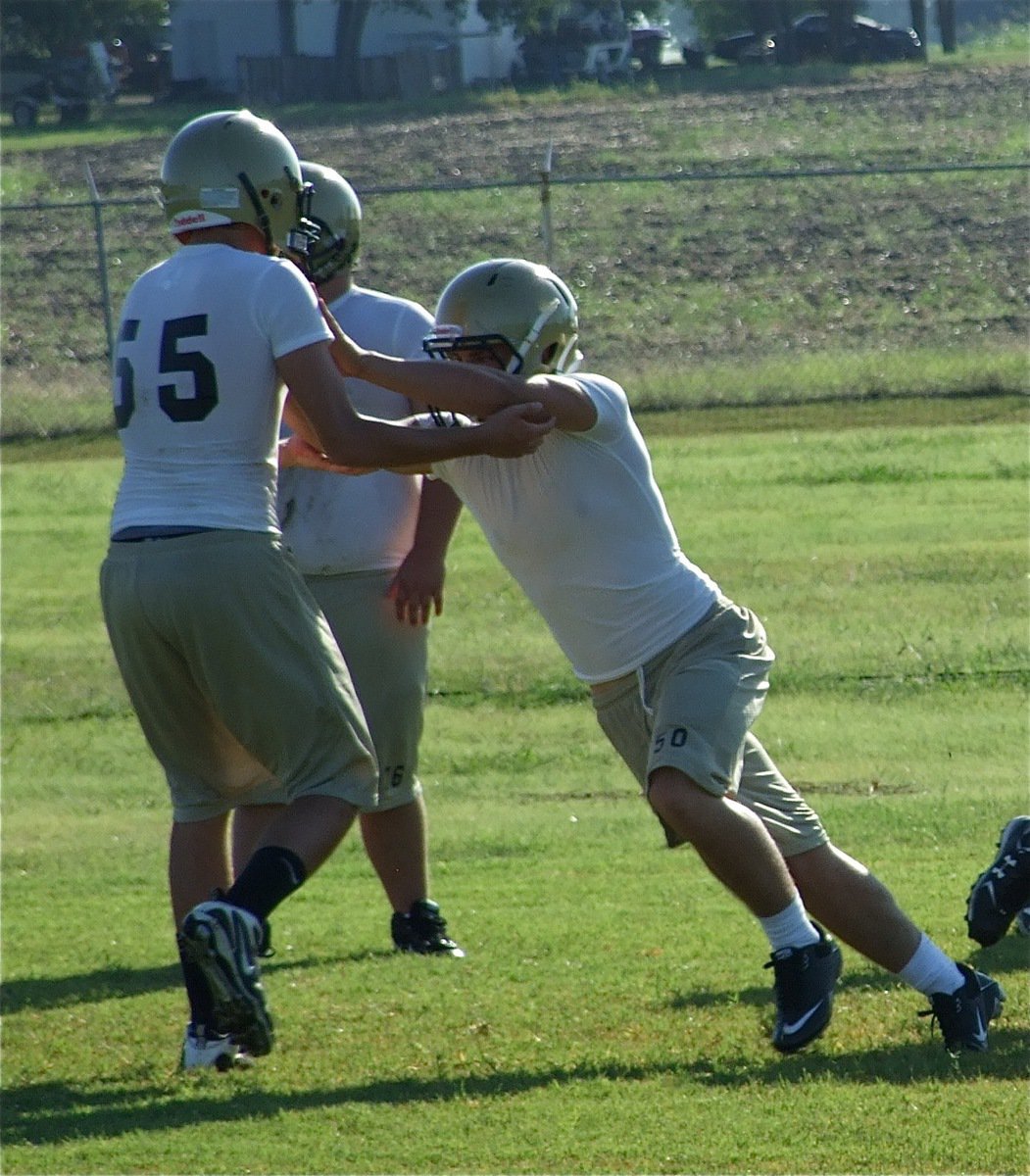 Image: Center push — Center Ethan Simon blocks down.