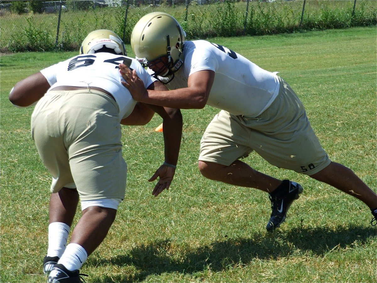 Image: Bobby vs Omar — Bobby Wilson(64) and Omar Estrada hold nothing back.