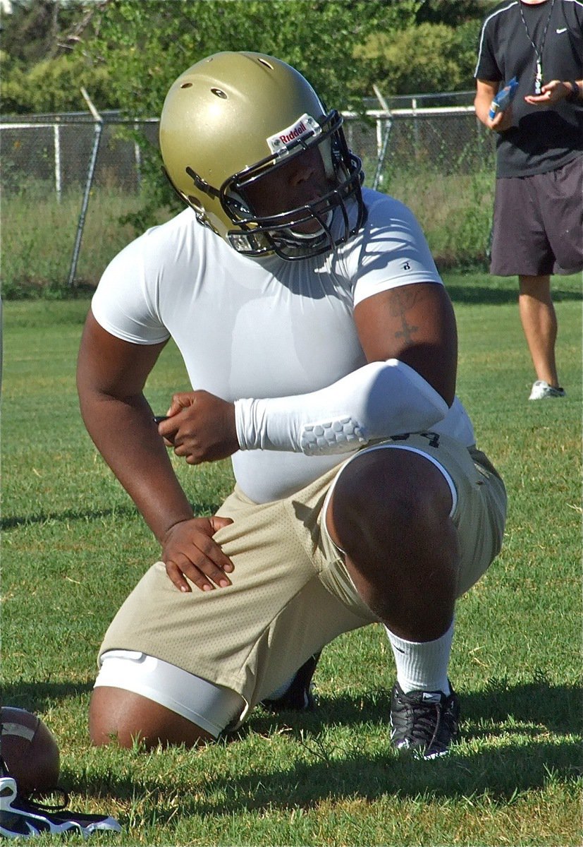 Image: Nose for the ball — Noseguard Bobby Wilson scans the offensive formation.