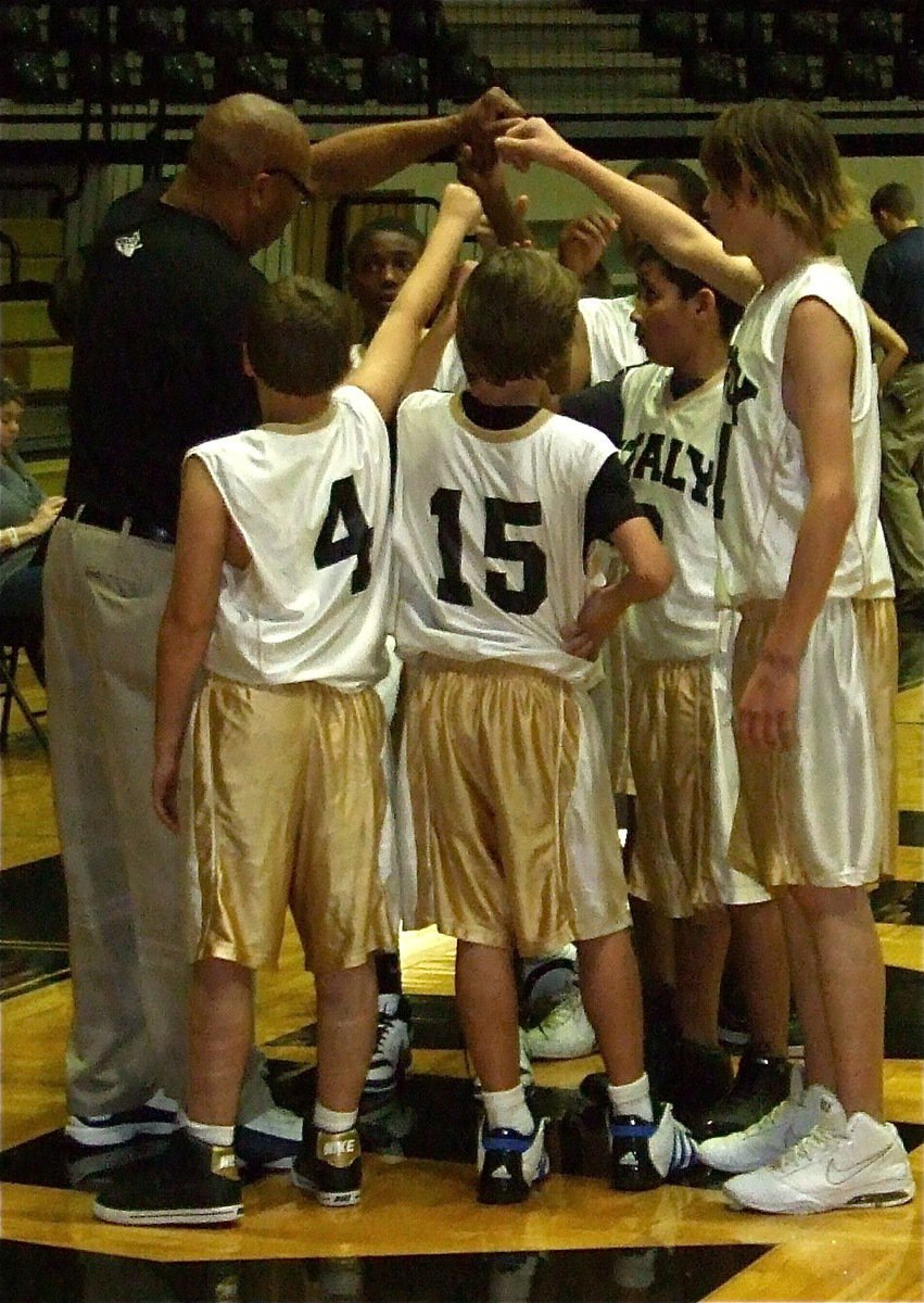 Image: Let’s finish strong! — Head coach Larry Mayberry, Sr. rallies the team late in the battle.