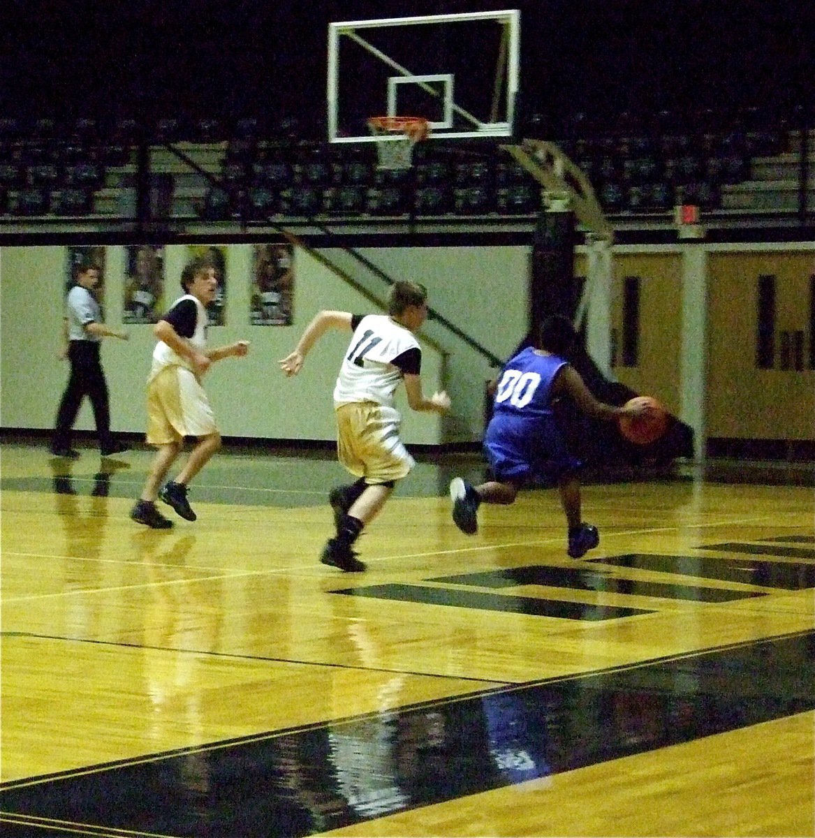 Image: Charging up the court — Italy’s Chace McGinnis(32) and John Escamilla(11) track down a Charger.