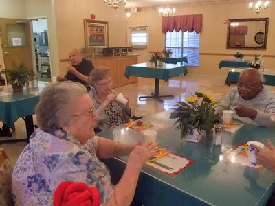 Image: More Partiers — These residents are enjoying the day while eating cake and ice cream.