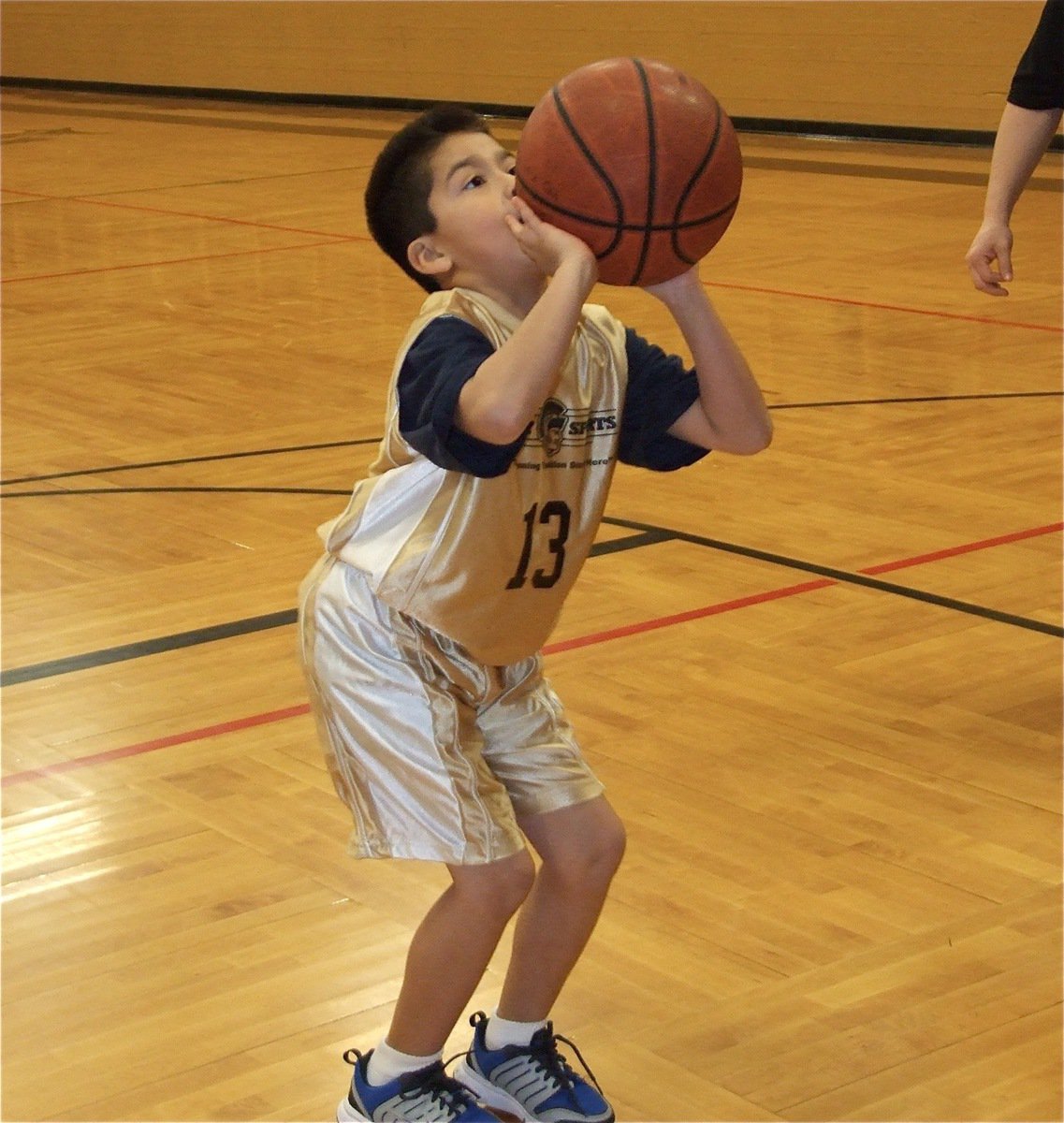 Image: Michael takes aim — Michael Gonzalez(13) feels lucky.