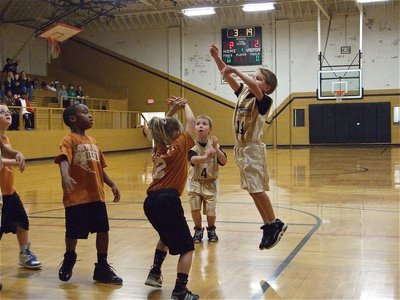 Image: Janek takes a jumper — Reese Janek(14) was fearless shooting the ball against Hillsboro.