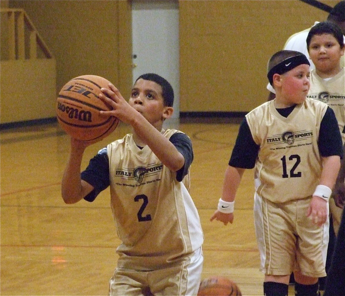 Image: Tylan eyes the rim — Italy 21’s Tylan Wallace(2) takes a free shot as Cade Roberts(12) gets ready to shoot next.