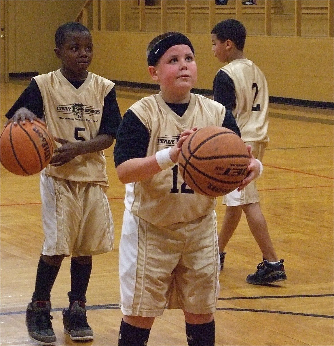 Image: Cade concentrates — Cade Roberts(12) shoots a free throw at halftime.