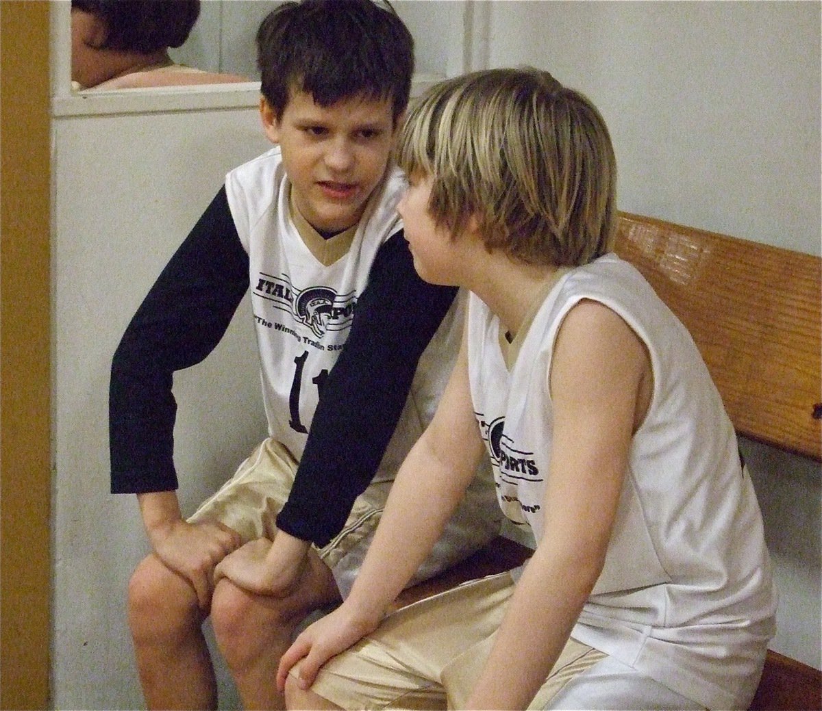 Image: Ty &amp; Stockard — Ty Hamilton(11) talks over the game plan with Stackard Smithwick(20) during the game. Both players scored 1-point apiece during the game.