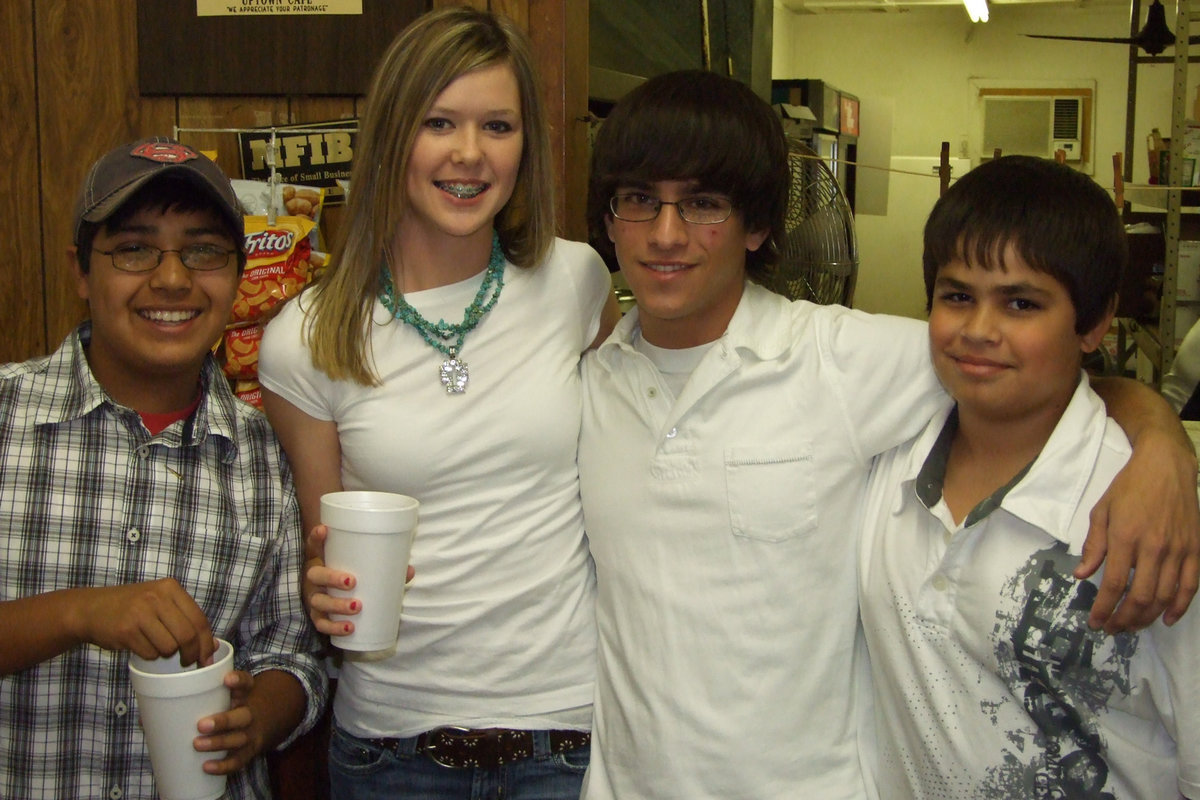 Image: Good Help These Days — Band members:  CJ, Kaitlyn, Collier and Jacinto helped with the Band Booster Spaghetti Supper on Saturday night.  Each band member helped with serving dinner and cleaning up afterwards.