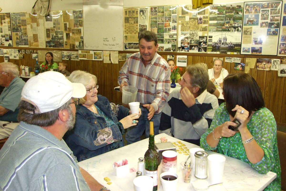 Image: Larry Working Hard — Even school board member, Larry Eubank, helped the band serve Saturday night.