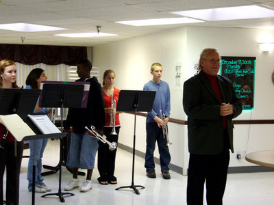 Image: Mike Trussell and band — Mike Trussell introducing the Milford High School band.