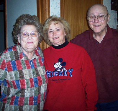 Image: Delivering to the Slovak’s — Brenda Trojacek visits with Raymond and Helen Slovak, Meals-on-Wheels clients.