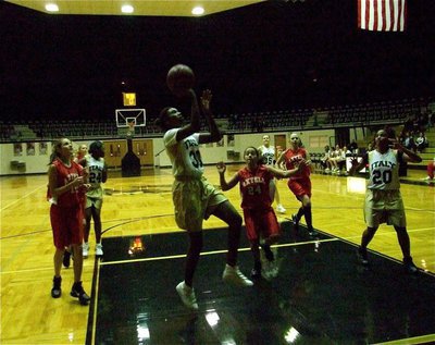Image: Robertson releases — Janae Robertson(30) takes advantage of a wide open layup against Axtell.