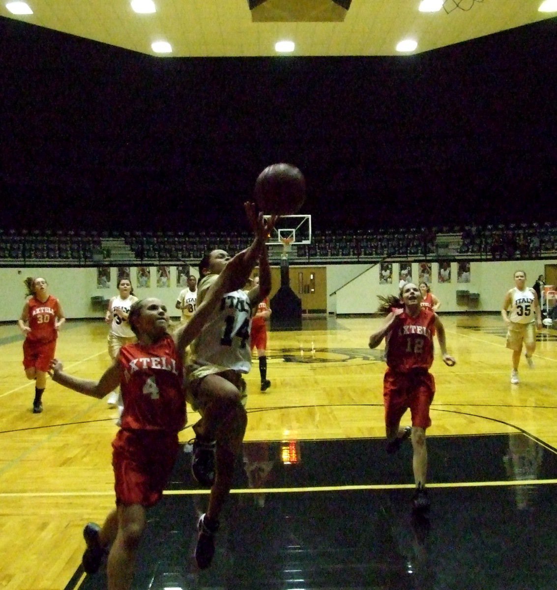 Image: Minton fouled — Italy’s Alex Minton(14) gets fouled on her way to the hoop during the 8B Girls game.