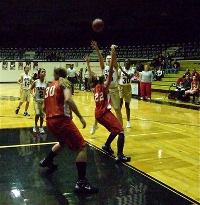 Image: Perry puts up shot — Lillie Perry(35) puts up a jumper over an Axtell defender.