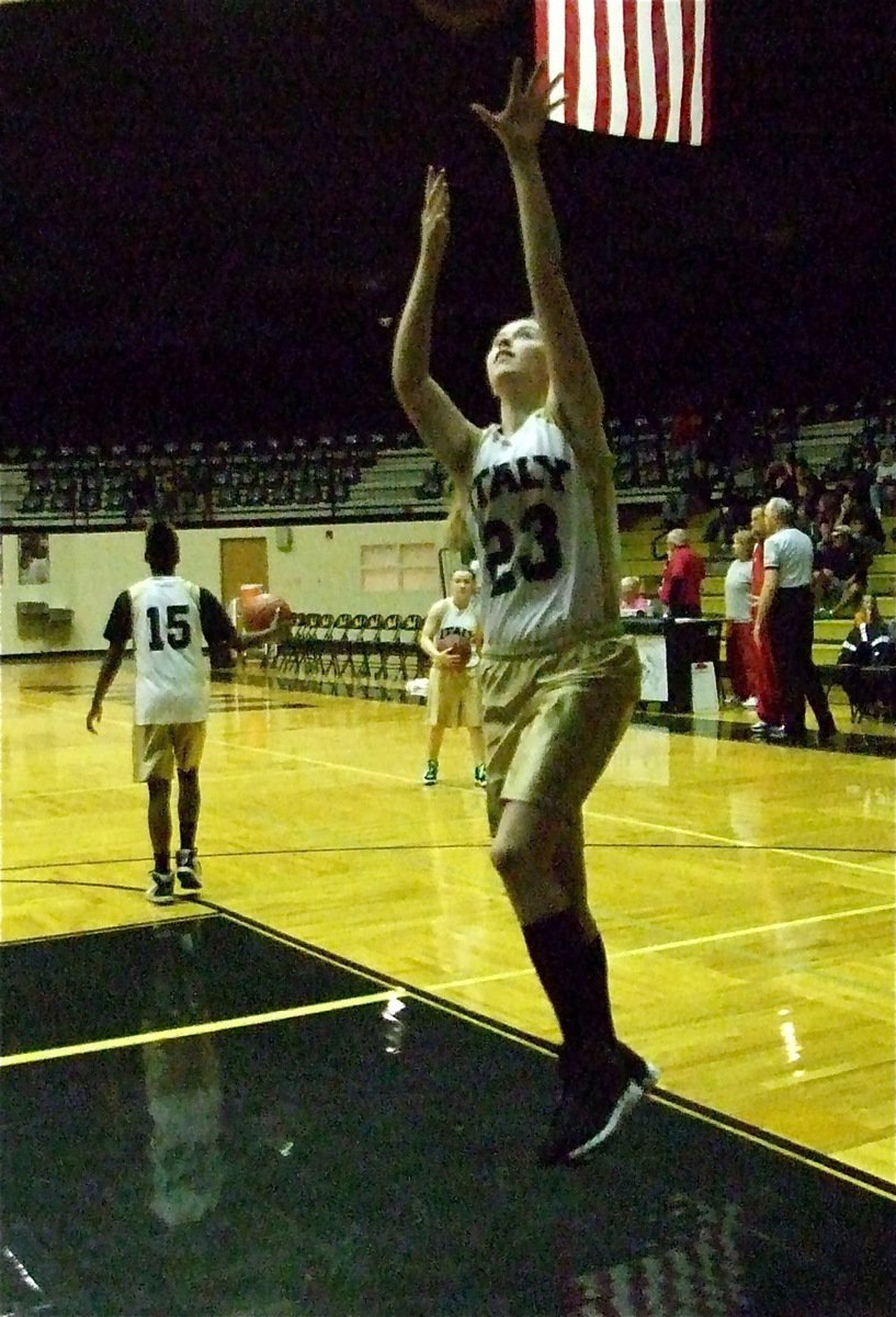 Image: How it’s done — Kelsey Nelson(23) gets ready to rumble against Axtell before the start of the 8A game.