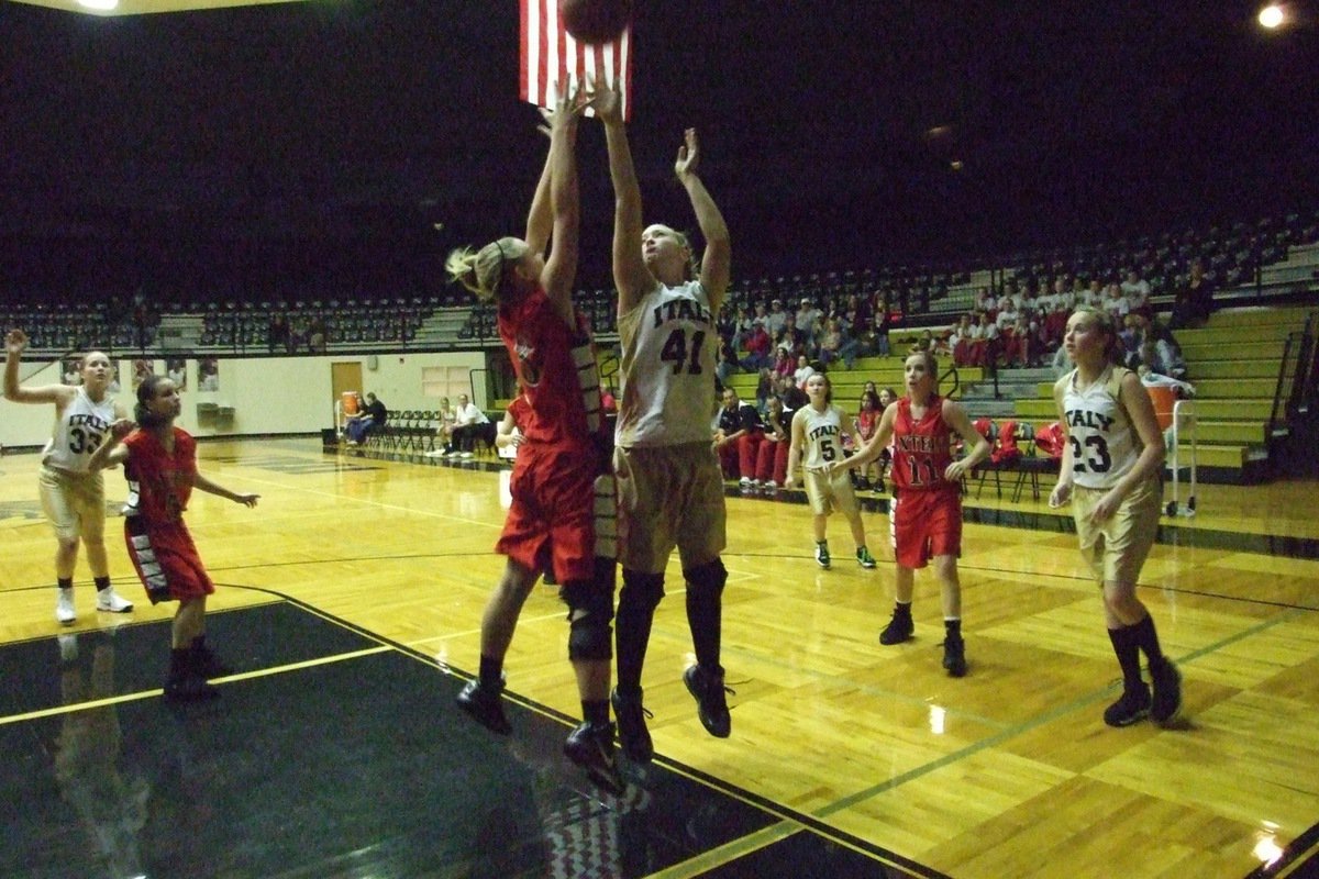 Image: Lewis down low — Jaclynn Lewis(41) banks one inside for 2-points against Axtell and finished the game with 7-points.