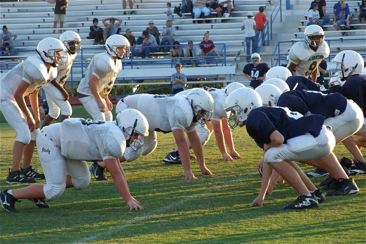 Image: The Italy JH defense scopes out the Leon Cougars’ offense — The Italy Junior High Gladiators dare the Leon Cougars to snap the ball. The young Gladiators turned in several big plays but the Cougars refused to be out played on their home turf.