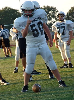 Image: You know it! — Kyle Fortenberry(50) starts at center for the Italy Junior High squad.