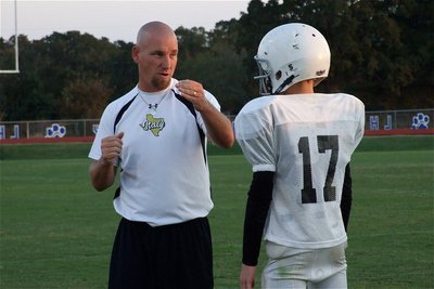 Image: Be the ball — Coach Jeff Richters talks with quarterback Ryan Connor.
