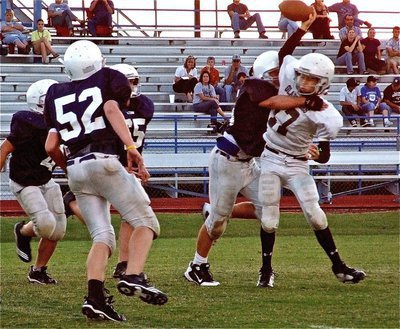 Image: Not this time — The Cougars reach Italy’s quarterback Ryan Connor(17) before he can deliver the pass.