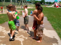 Image: Band of Water Warriors — These little “Water Warriors” were having fun raging war with squirt bottles.