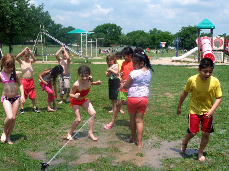 Image: Should I Run Through — This first grader can’t decide if she wants to run through the ice cold water.