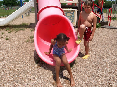 Image: I Made It — She made it through the slide.