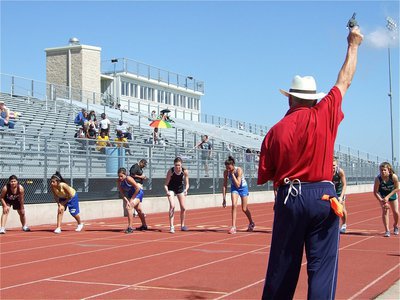 Image: Kaitlyn’s ready — Italy ISD Superintendent Mr. Jimmie Malone fires the gun to start the 3200m race which included, Italy’s own, Kaitlyn Rossa in lane 5. Rossa finished 2nd in the event.