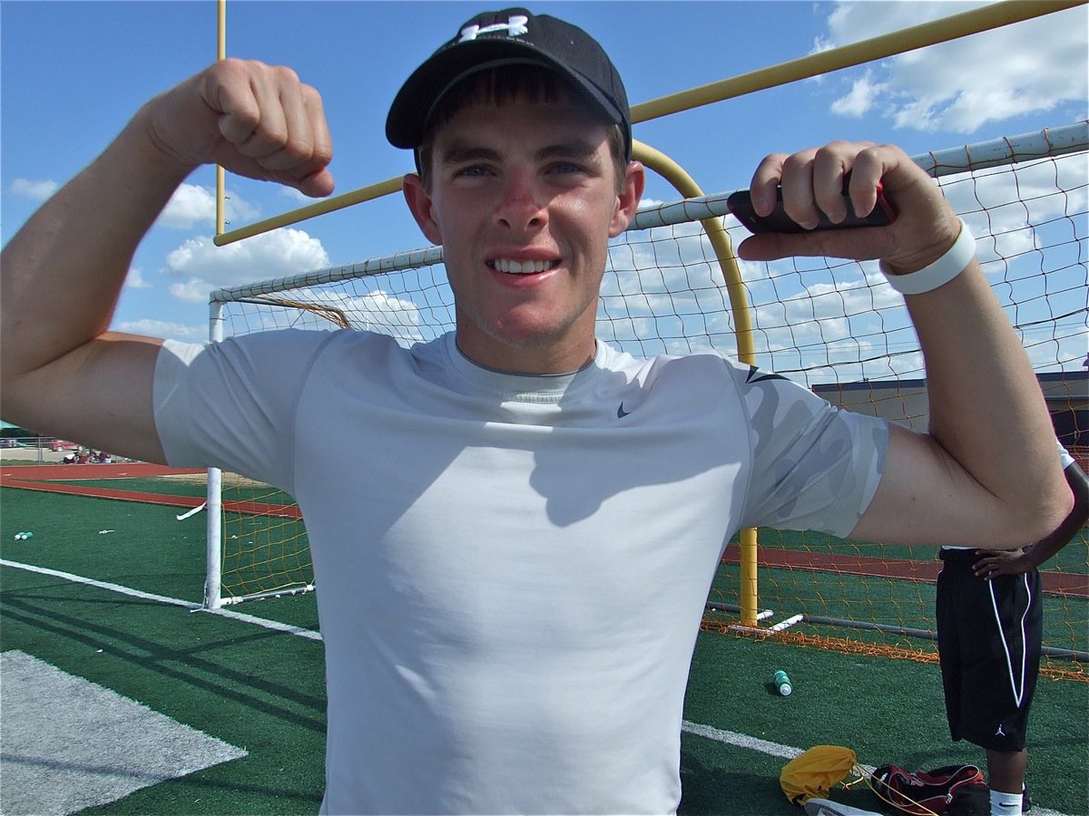 Image: Proud of his team — Ryan Ashcraft experiences a moment of pure joy, excited at how well he and his teammates were performing during the Area track meet.