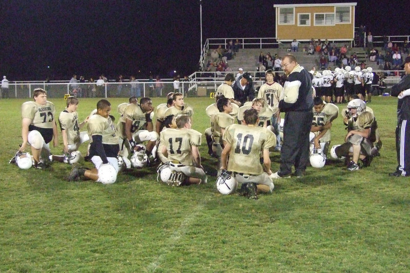 Image: Gladiator pep talk — Coaches let the players know they performed well.