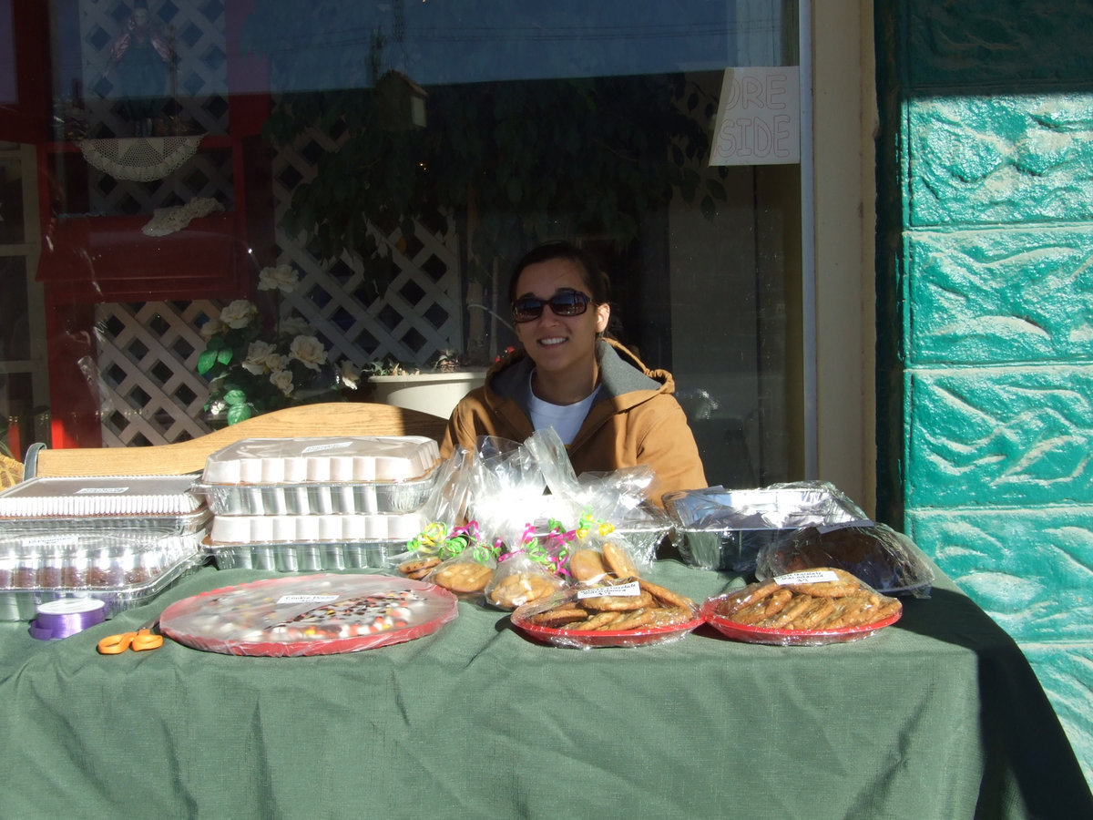 Image: Lots of goodies — Kasey Montgomery is one of the dedicated Silver Bullets Relay for Life team members.