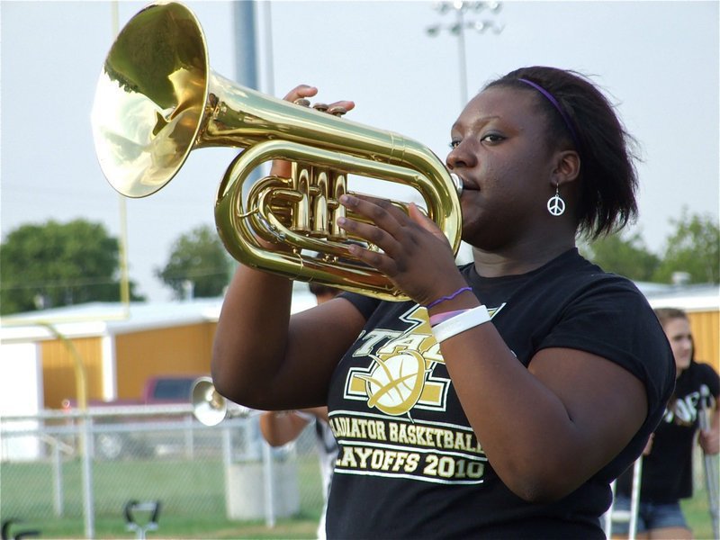 Image: Reed can play — Jimesha “I be jamming” Reed keeps time with the beat.