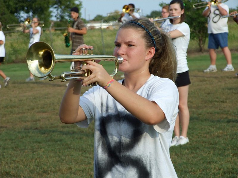 Image: Tara Wallis — Tara plays her trumpet with the same intensity she plays sports.