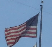 Image: How proud it waves — The flag of the United States of America, the symbol of our freedom and the banner of our veterans.