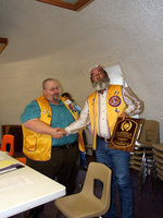 Image: Mark Souder Receives Award — Mark Souder was presented an award by Arval Gown (current president) for his outstanding service as president of the Italy Lions Club for two years.