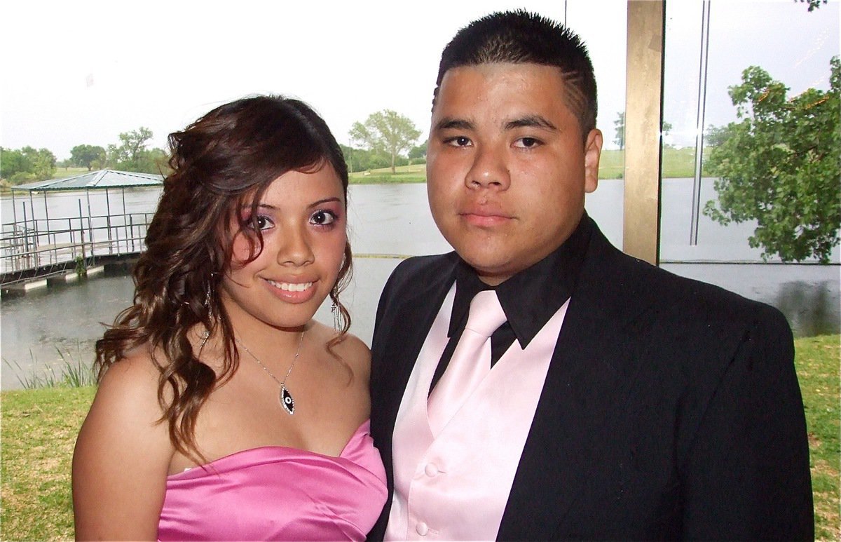 Image: Cute couple — Yasenia Rodriguez and her handsome fellow, Kevin Suaste, pose in front of the lake at the Waxahachie Country Club.