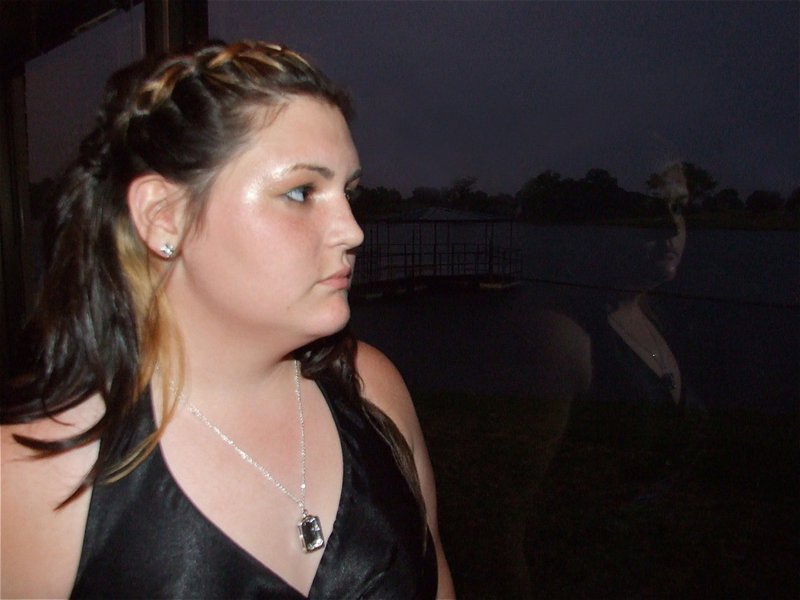 Image: Meredith reflects — Meredith Brummett reflects on her senior year during the prom.