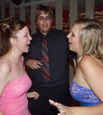 Image: Singing and Dancing — Breanna Smith, Anthony Fontenot and Megan Hopkins sing and dance prom night away.