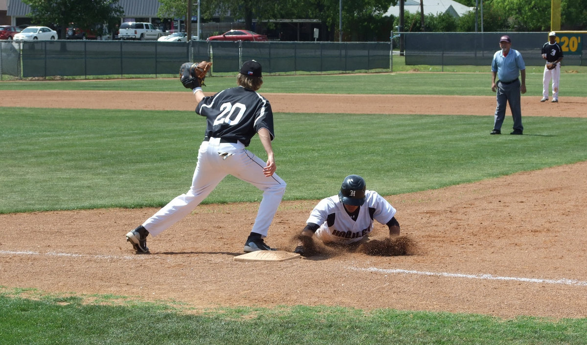 Image: Close but no cigar — Colten Campbell tries to get this Bearcat out at first.