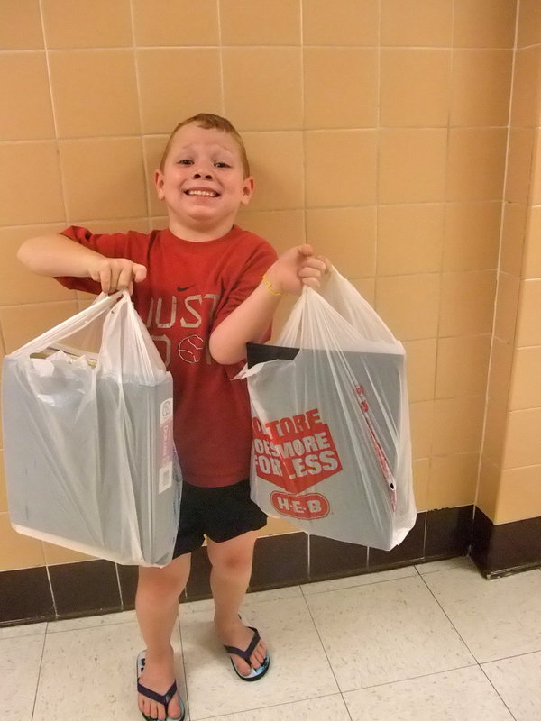 Image: Is It Too Heavy? — Nicolas Svhelak is ready to start kindergarten.