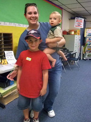Image: The Everett Family — Garret, Melanie and Hunter Everett are meeting the teacher. Garret is in Mrs. Morgan’s first grade class. “I can’t wait to read.”