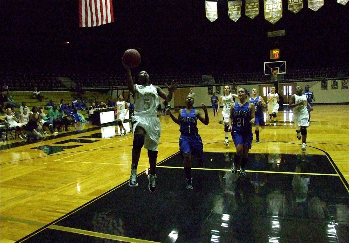 Image: Copeland scores — Jameka Copeland(5) rises for two of her 6-points as the Italy Lady Gladiators move past Milford in the first round of the Gladiators Invitational Tournament, 54-15.