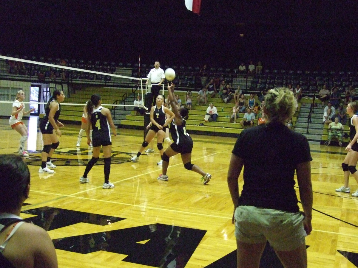 Image: Brianna makes ready — Brianna Burkhalter takes on the task of the set up for the front line.