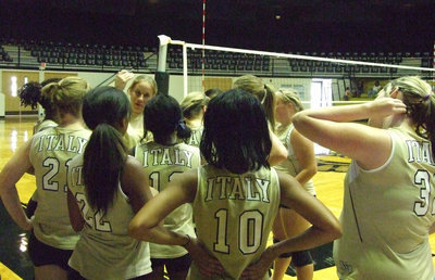 Image: Lady Gladiator JV team — Coach Jennifer Reeves gathers her team for some last minute pointers on Tuesday night.  The JV Lady Gladiators played against the Avalon Lady Eagles.