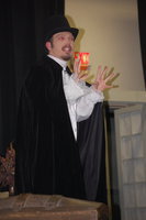 Image: Pure evil — Jacob Rose as Ferguson Longfellow explains his evil plans.