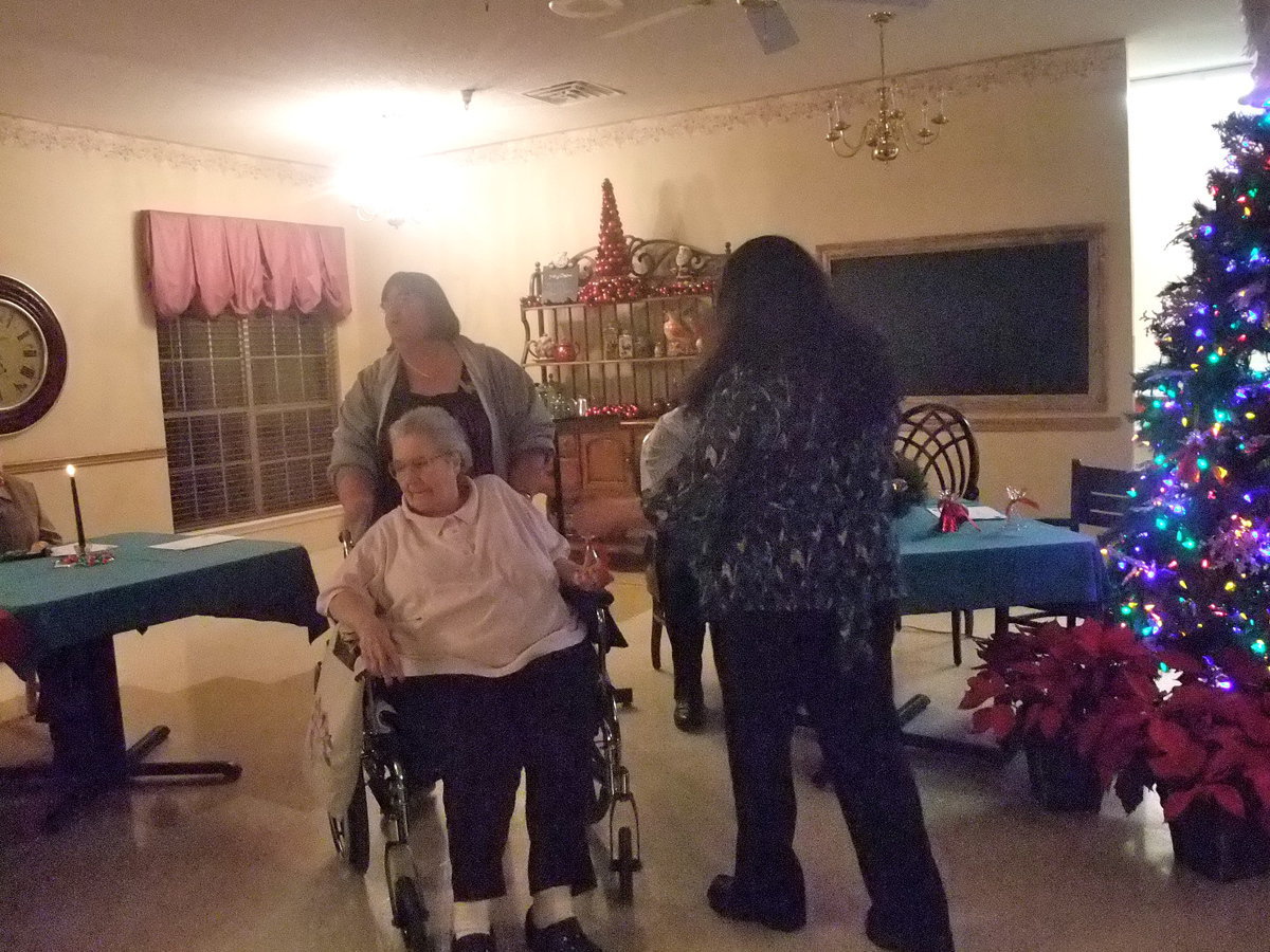 Image: Mrs. Devore — Mrs. Devore ready to put her husband’s (Don Devore) angel on the tree.