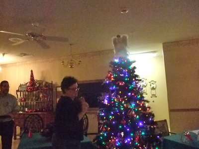 Image: Debbie Knott  — Debbie was hanging Odell Kelly’s angel on the tree.